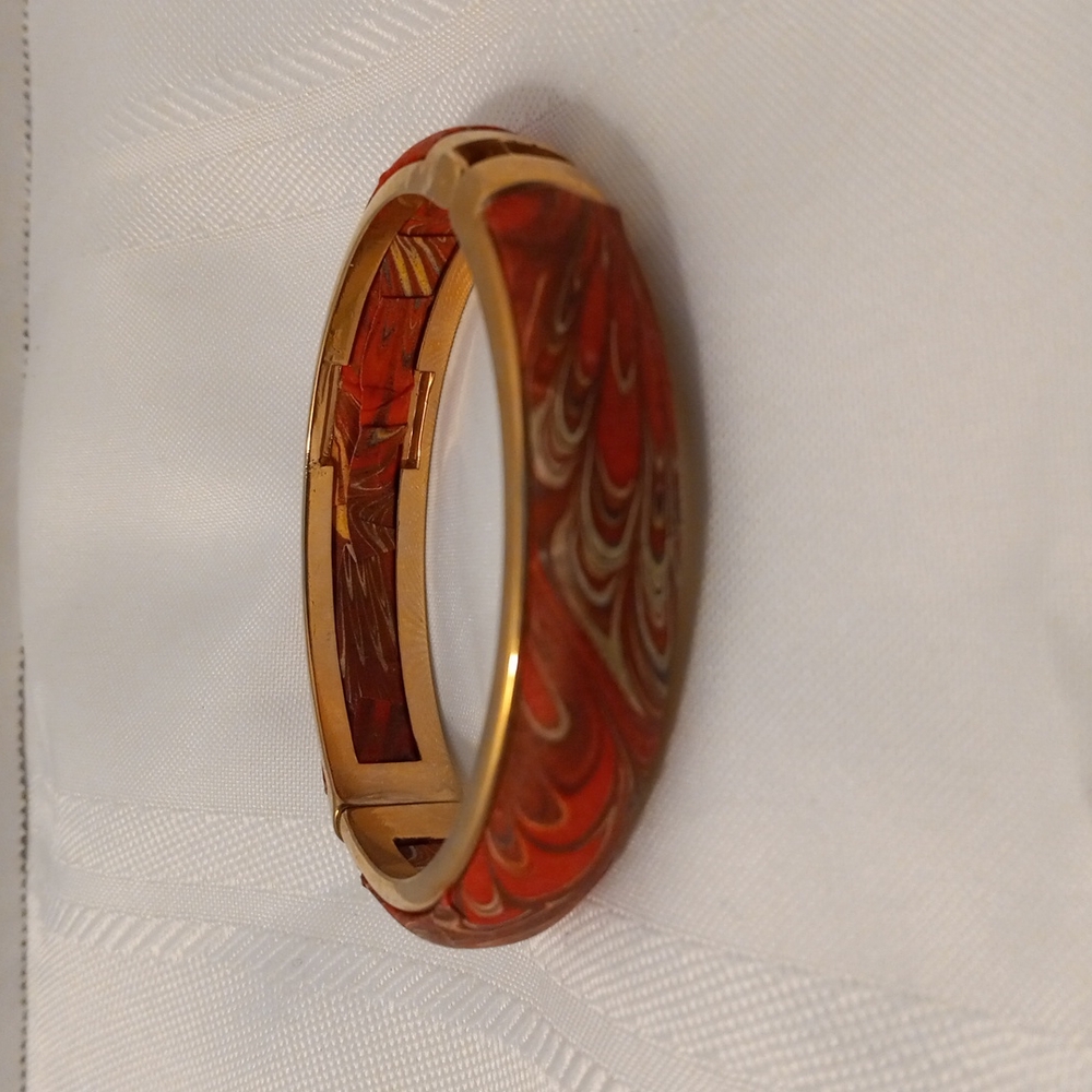 Gold tone and Swirl print cuff bracelet approximately 3 inches in diameter